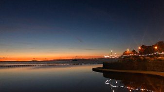 Lights reflected in the lake after sunset